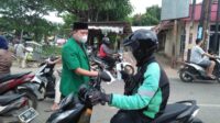 Kegiatan pembagian masker oleh GP Anshor dalam rangka sosialisasi Prokes